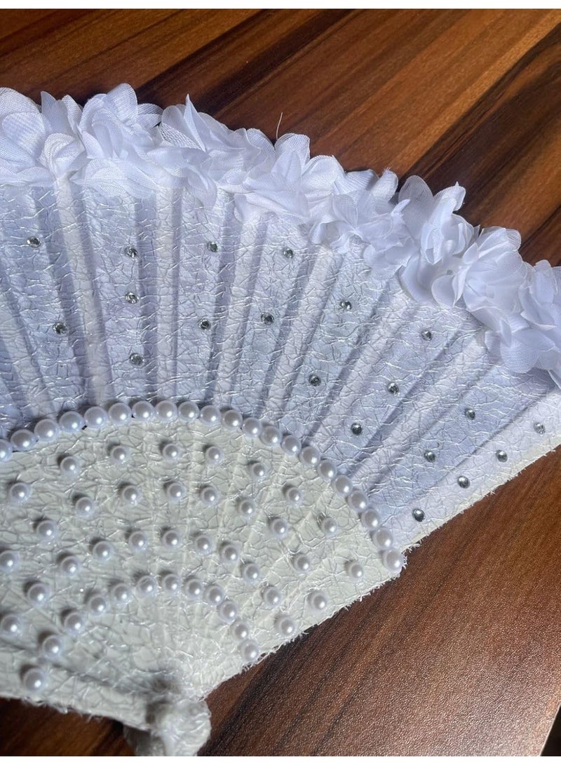 The luxurious white bridal fan - decorated with sparkling beads and soft roses, is a unique and elegant piece that adds a charming touch to the bride's look on her special day. - Image 1