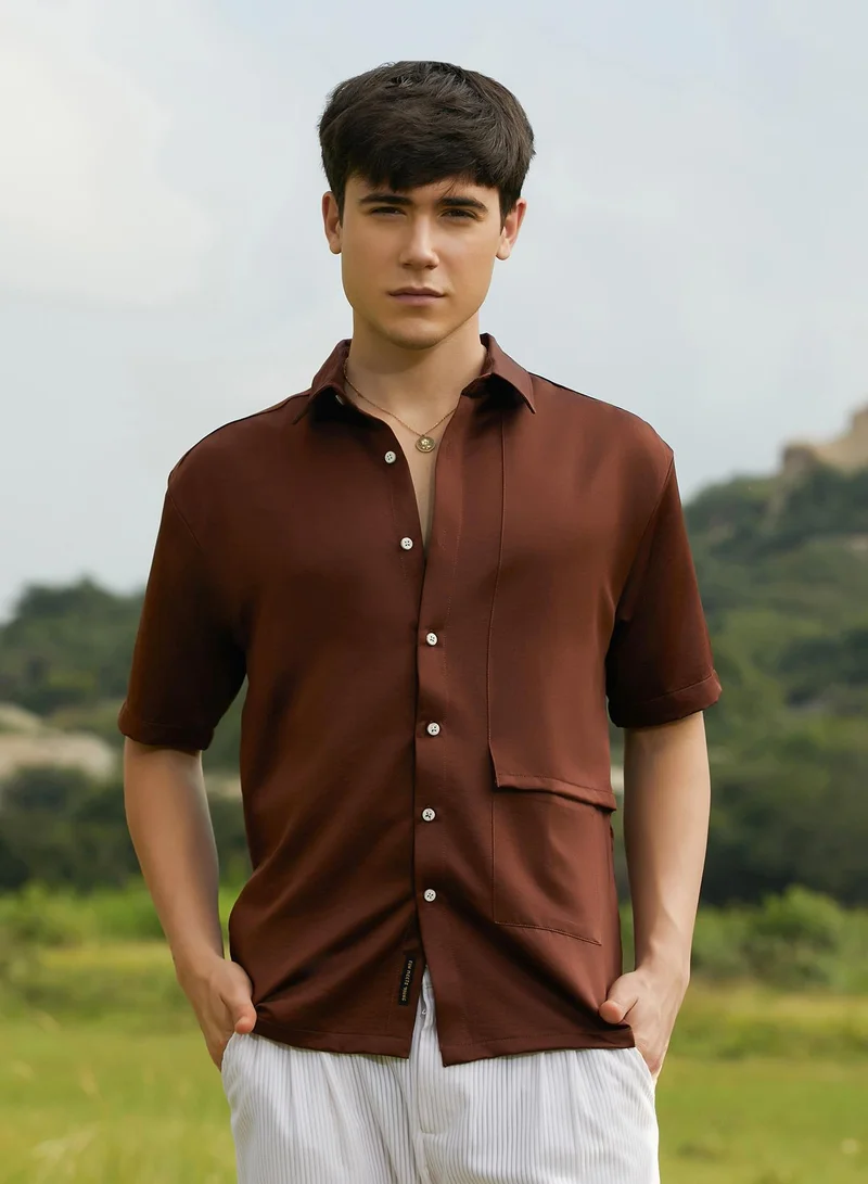 Campus Sutra Campus Sutra Men's Chocolate Brown Solid Flap Oversized Shirt For Casual Wear | Spread Collar | Short Regular Sleeves | Button Closure | Oversized Shirt Crafted With Comfort Fit For Everyday Wear