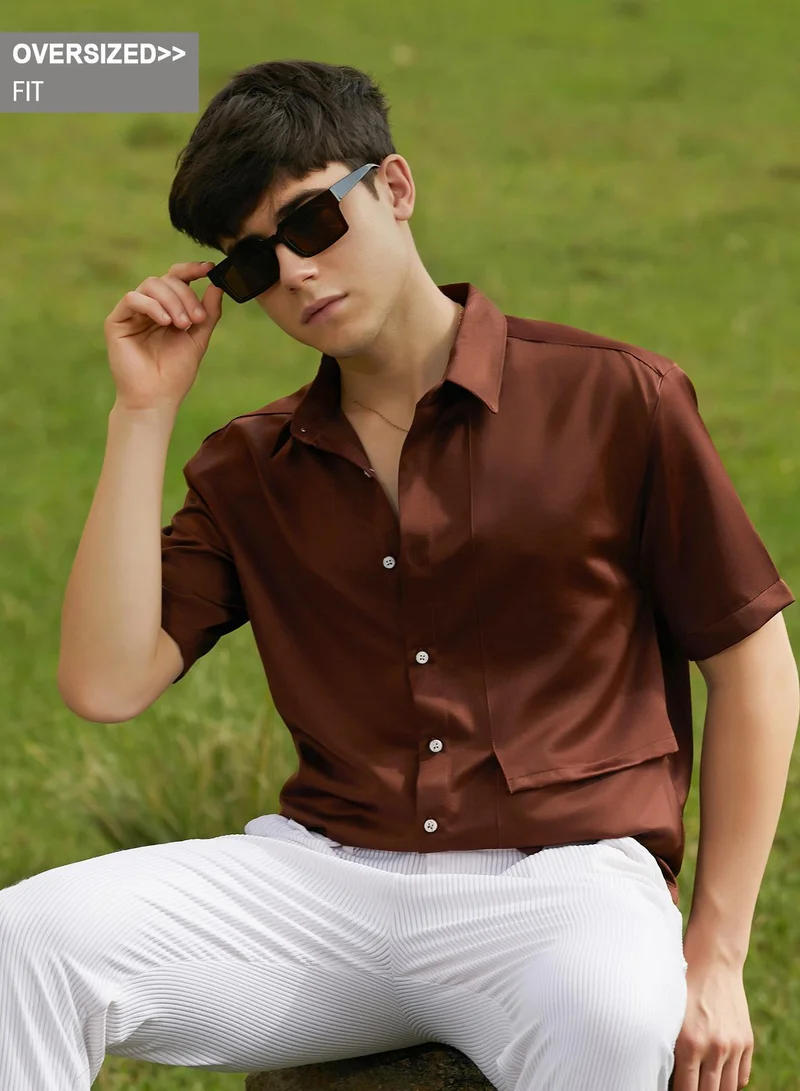 Campus Sutra Campus Sutra Men's Chocolate Brown Solid Flap Oversized Shirt For Casual Wear | Spread Collar | Short Regular Sleeves | Button Closure | Oversized Shirt Crafted With Comfort Fit For Everyday Wear