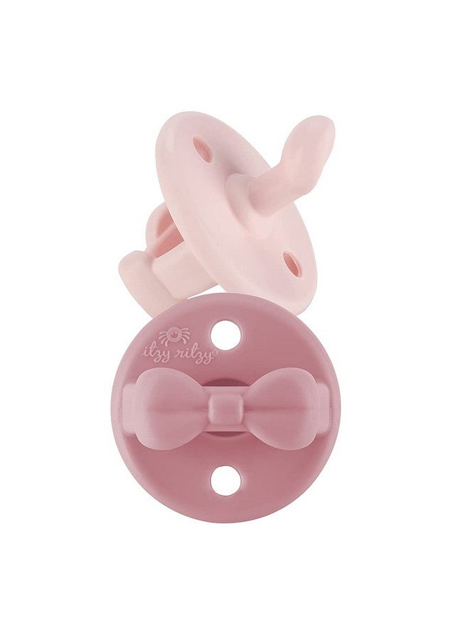 Itzy Ritzy لهايات إيتزي ريتزي السيليكونية التقويمية - لهاية إيتزي مع مقبض قابل للطي وفتحتين للهواء لزيادة الأمان، لهايات للأطفال من عمر 0 - 6 أشهر (حذاء الباليه وزهرة الربيع) - Image 1
