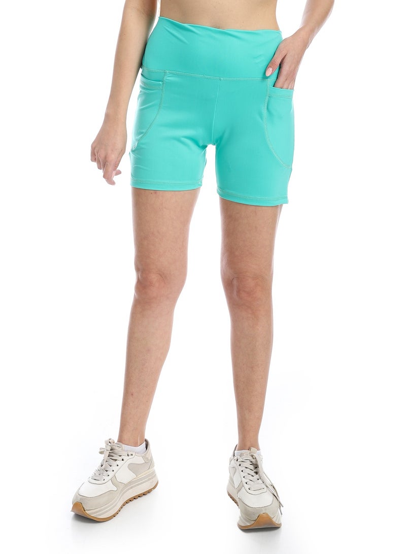 سيزار شورت رياضي حريمي بجيوب جانبية - Image 1