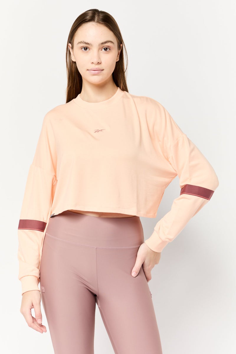 Reebok Women Sportswear Fit Long Sleeve Outdoor Crop Sweatshirt, Peach - Image 1