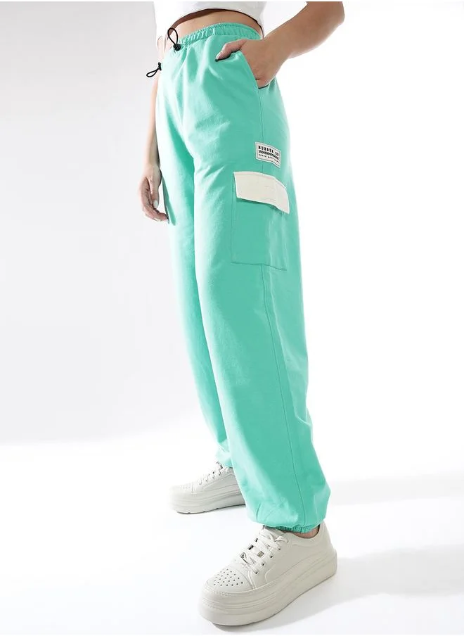 هوبرهولمي Women Track Pants in Blue featuring Jogger fit with a printed pattern, no sleeves, regular length, secured with elasicated + drawstring closure, crafted from terry – crafted for those who appreciate style and comfort.
