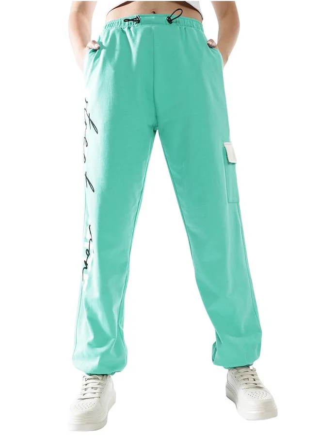 هوبرهولمي Women Track Pants in Blue featuring Jogger fit with a printed pattern, no sleeves, regular length, secured with elasicated + drawstring closure, crafted from terry – crafted for those who appreciate style and comfort.