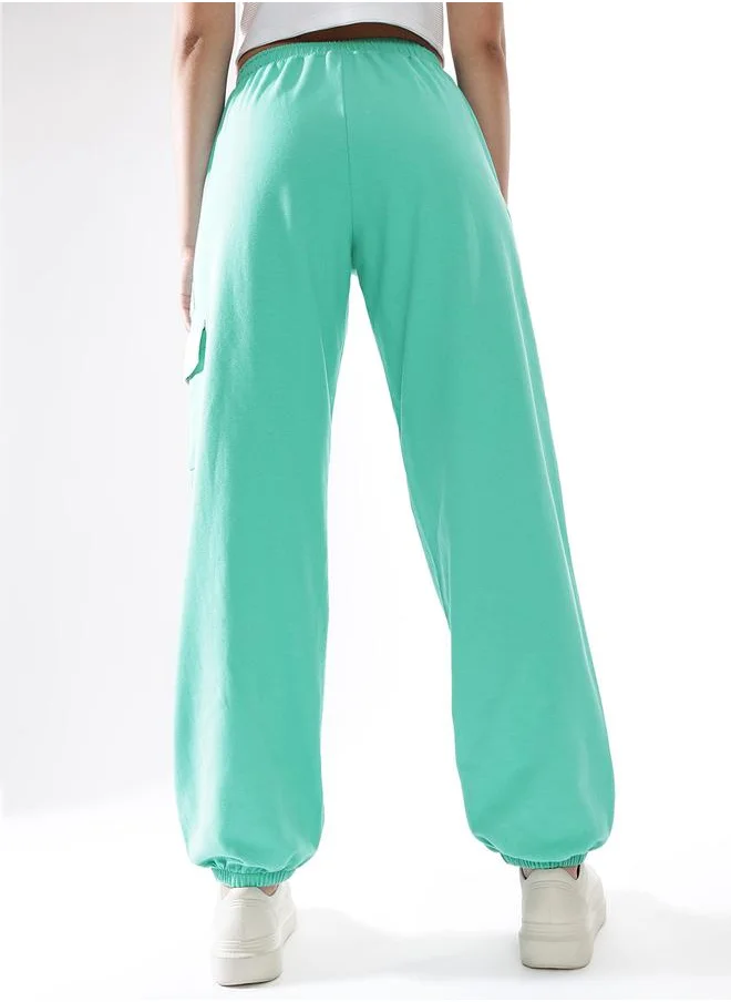 هوبرهولمي Women Track Pants in Blue featuring Jogger fit with a printed pattern, no sleeves, regular length, secured with elasicated + drawstring closure, crafted from terry – crafted for those who appreciate style and comfort.