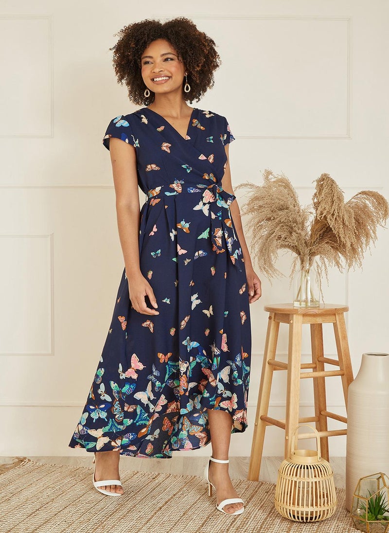 Yumi - Yumi Navy Butterfly Print Dip Hem Midi Wrap Dress - Image 1