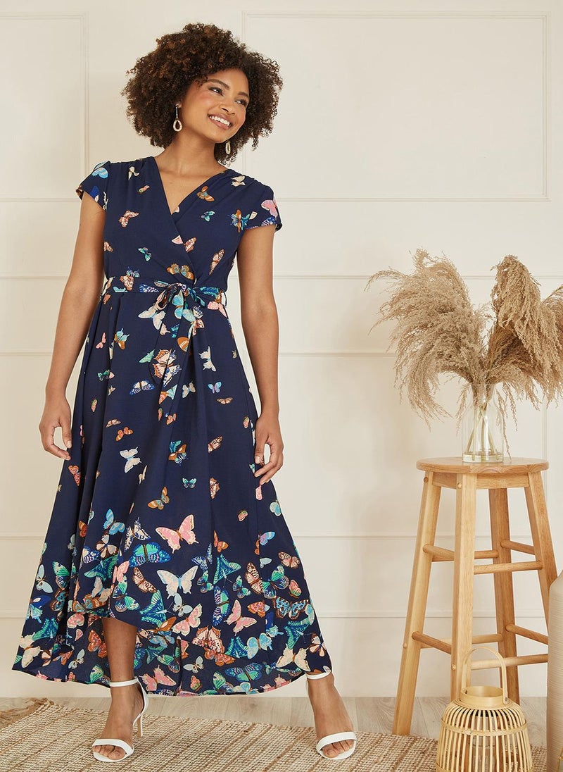 Yumi - Yumi Navy Butterfly Print Dip Hem Midi Wrap Dress - Image 1