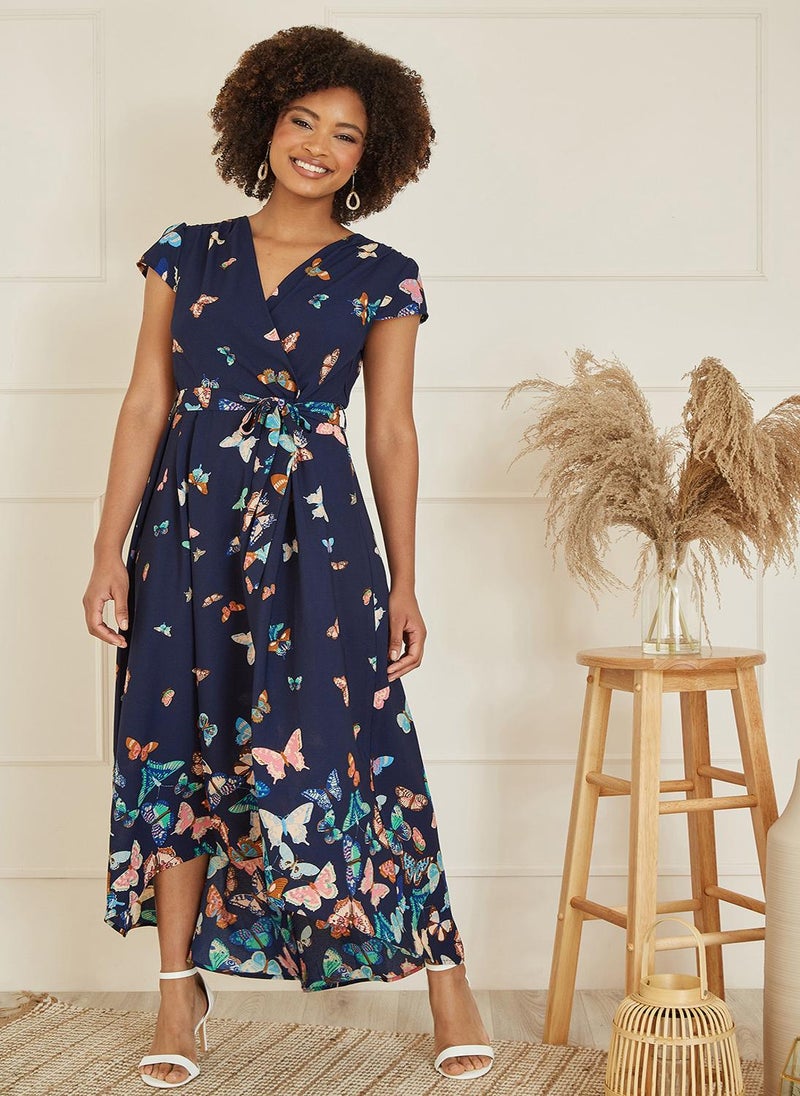 Yumi - Yumi Navy Butterfly Print Dip Hem Midi Wrap Dress - Image 1