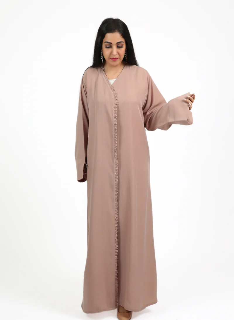 Nikias Pink Nida abaya featuring a pleated outer layer with a matching inner lining