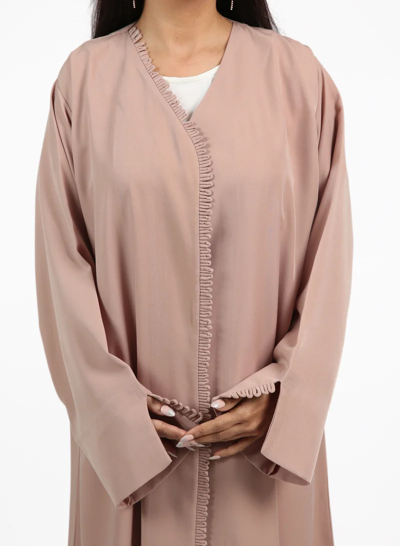 Nikias Pink Nida abaya featuring a pleated outer layer with a matching inner lining