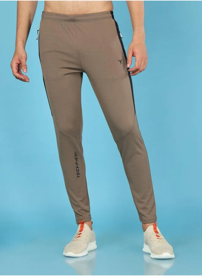 تكنوسبورت Men Solid Slim Fit Track Pants with TECHNO DRY
