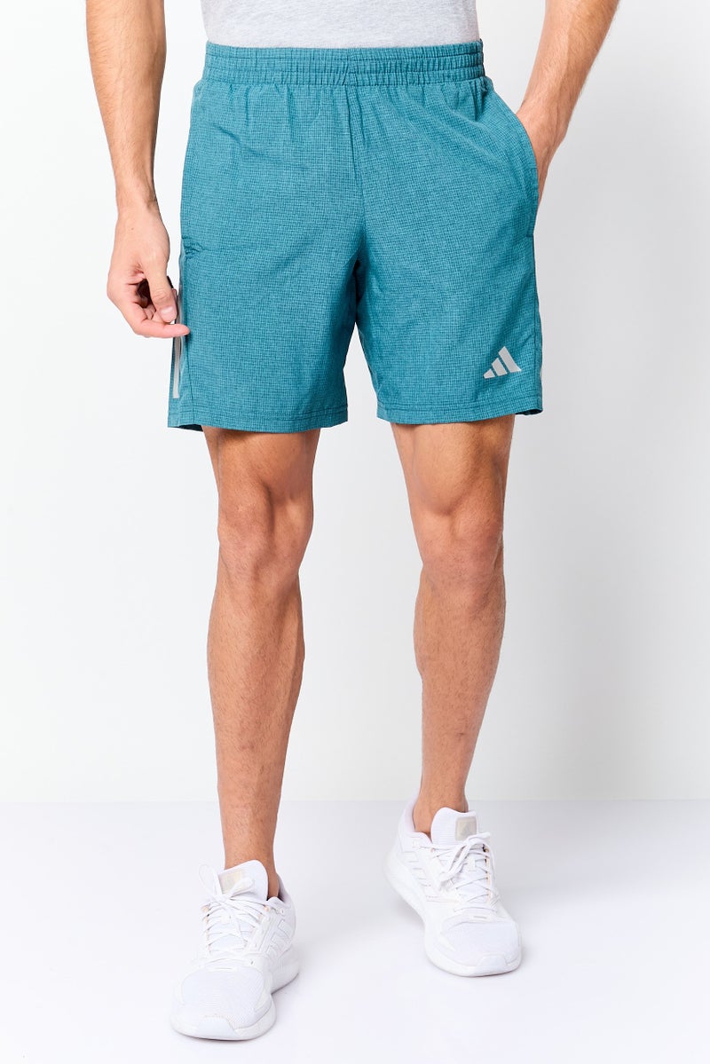 Adidas شورتات تدريب رياضية للرجال بطول 7 إنش، أخضر مائل إلى الأزرق - Image 1