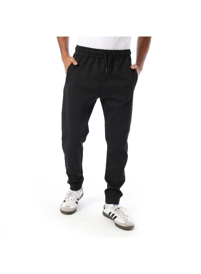 Caesar Men's athletic-style trousers with side pockets. - Image 1