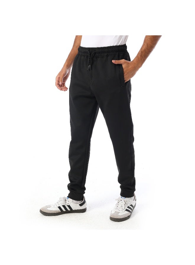 Caesar Men's athletic-style trousers with side pockets. - Image 2