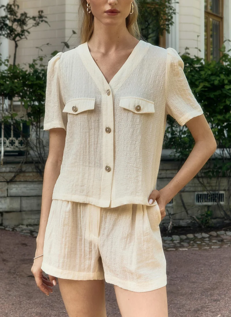 Lichi  Mini shorts in textured fabric with waist pleats for Women | Best Price UAE