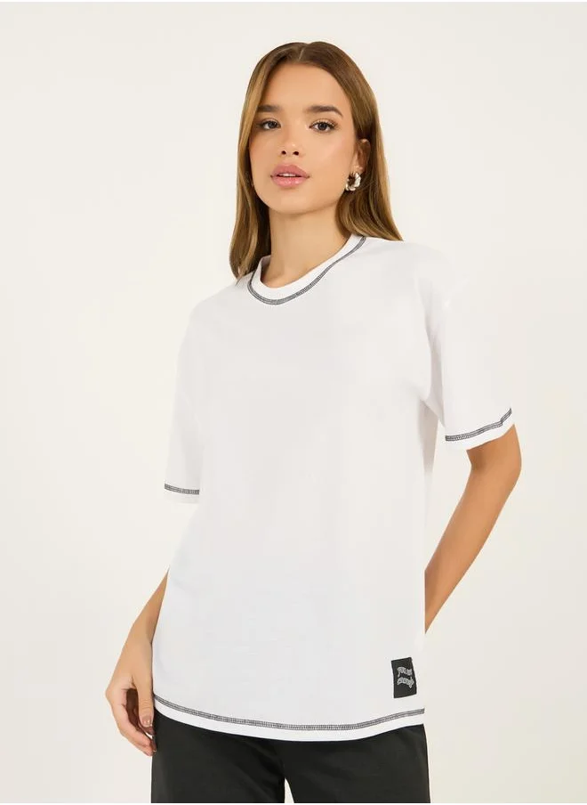 Styli Contrast Stitch Oversized T-Shirt with Badge Slogan Print Detail