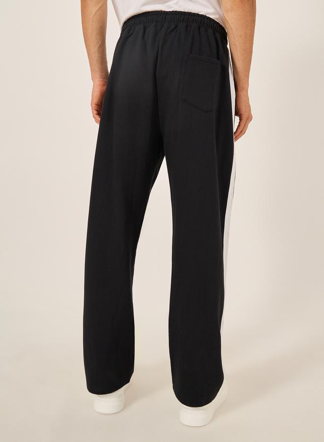 Styli Oversized Wide Tuck Fleece Joggers with Side Stripe and Print Detail - Image 4