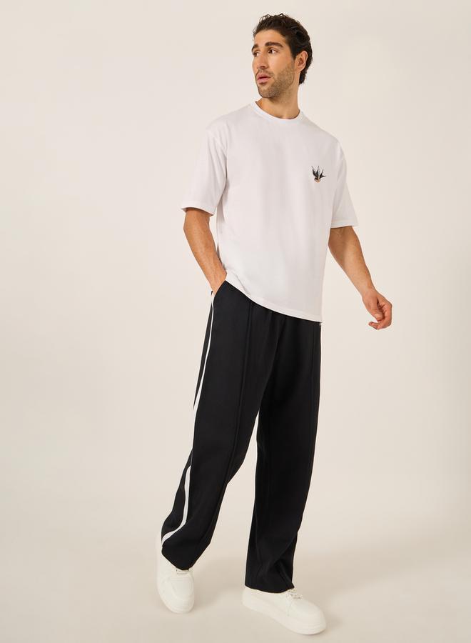 Styli Oversized Wide Tuck Fleece Joggers with Side Stripe and Print Detail - Image 2