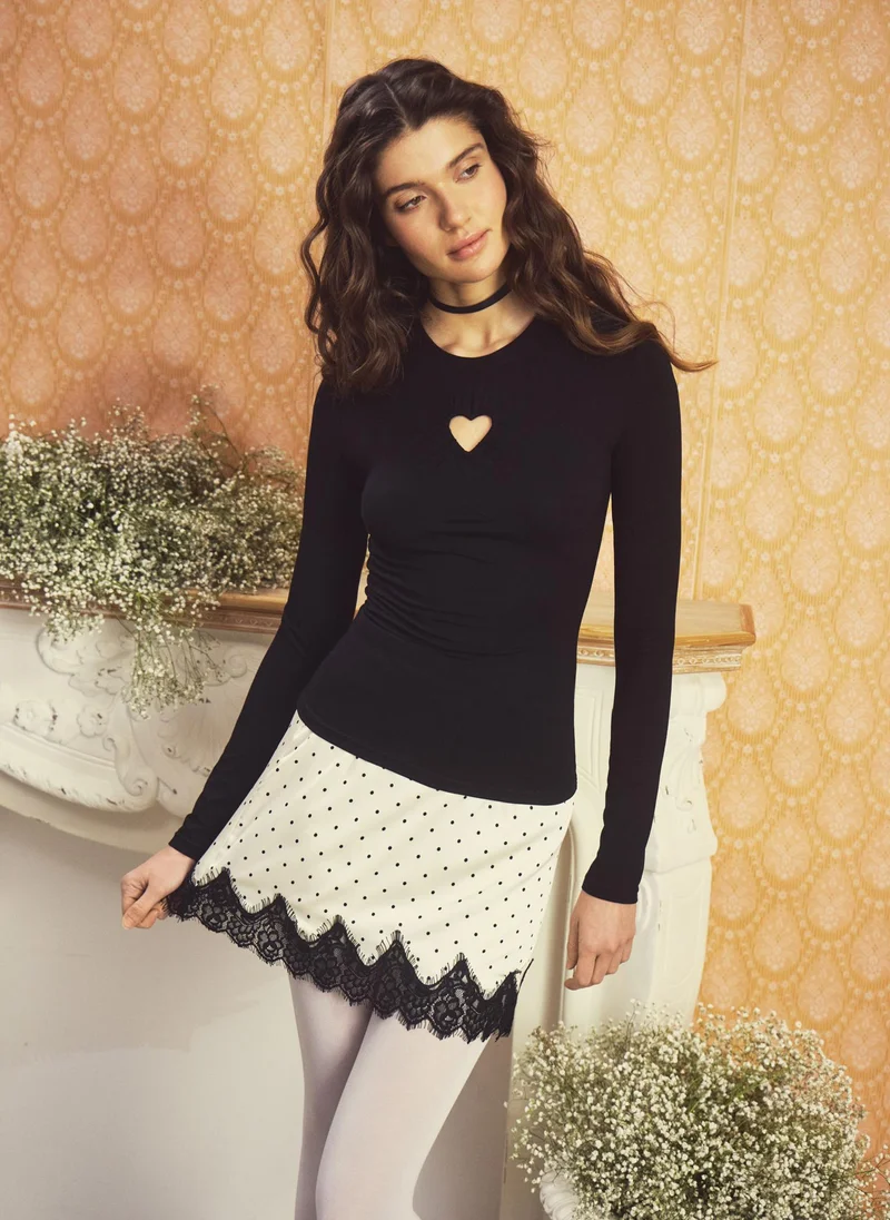 Lichi  Polka dot mini skirt with lace trim for Women | Best Price UAE