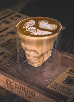 Glass cup with skull head design