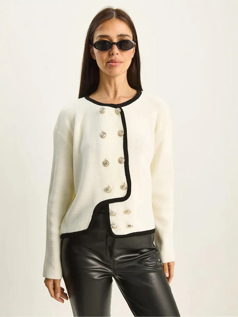 بيانكو لوتشي كارديجان بأزرار محبوك مضلع من لوكسي
