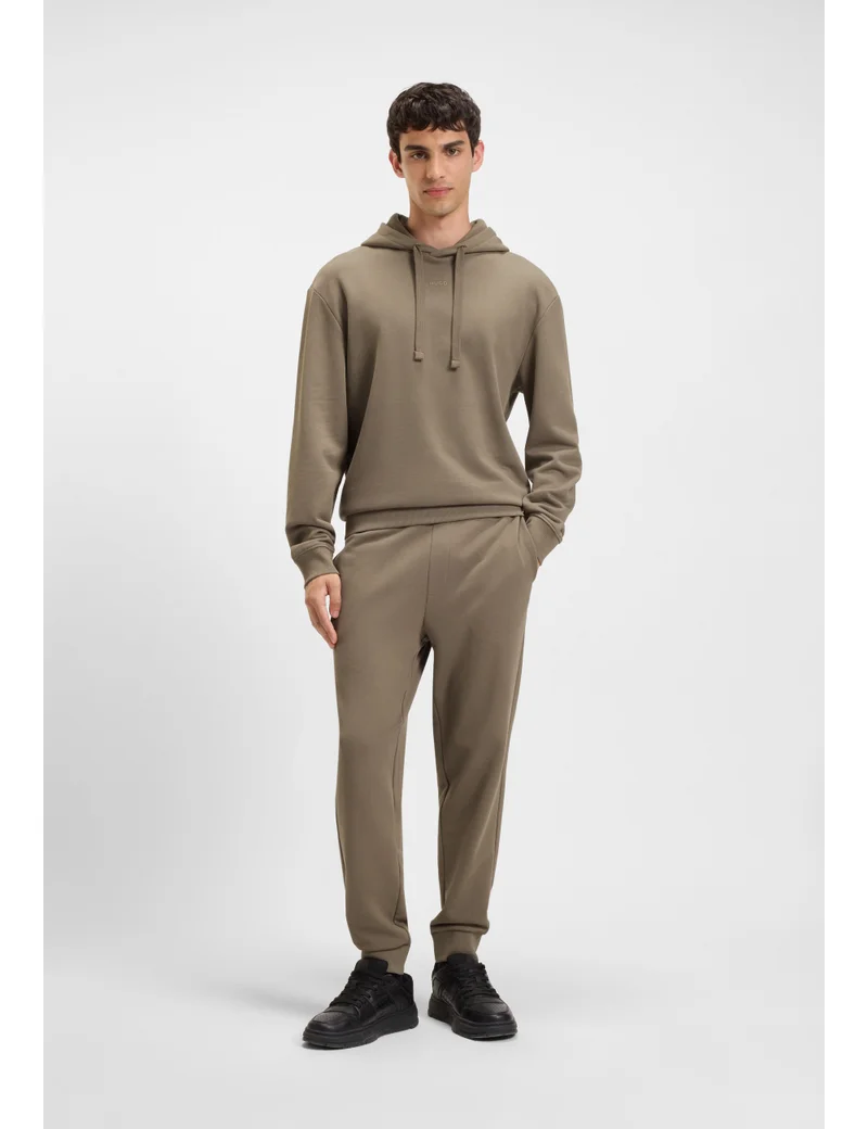 HUGO Cuffed tracksuit bottoms in cotton terry with logo print
