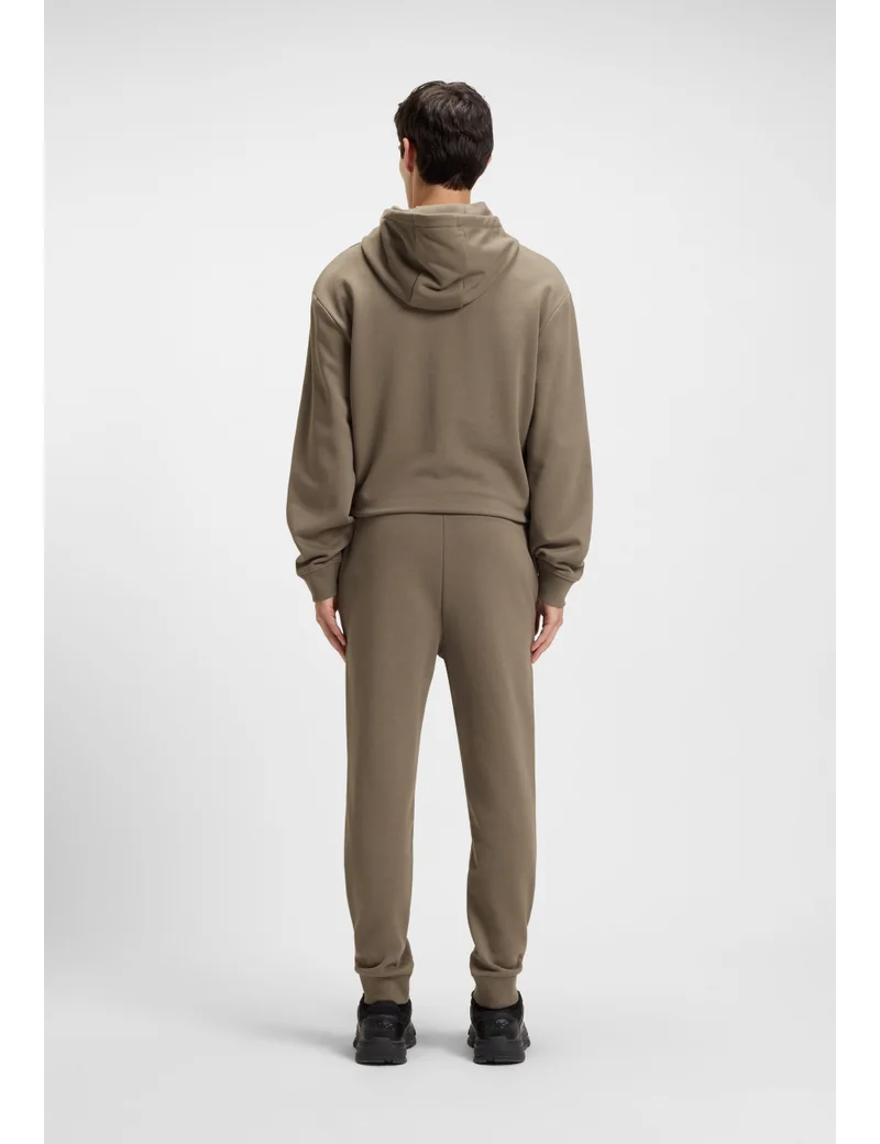 HUGO Cuffed tracksuit bottoms in cotton terry with logo print