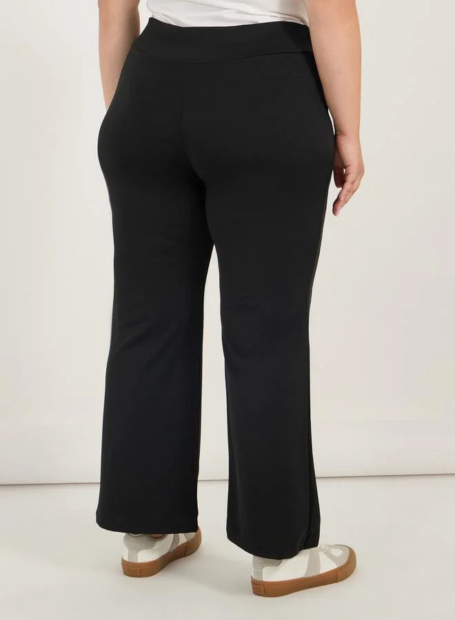 Styli Plus Size Criss-Cross Waistband High Rise Flared Pants