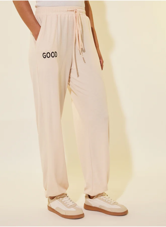 Styli Typography Print Drawstring Waist Wide Leg Joggers