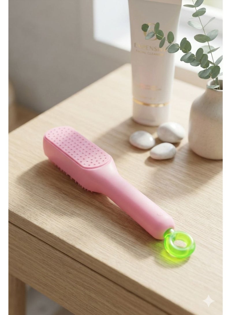 A hair straightening brush and comb with buttons for cleaning the brush - Image 2