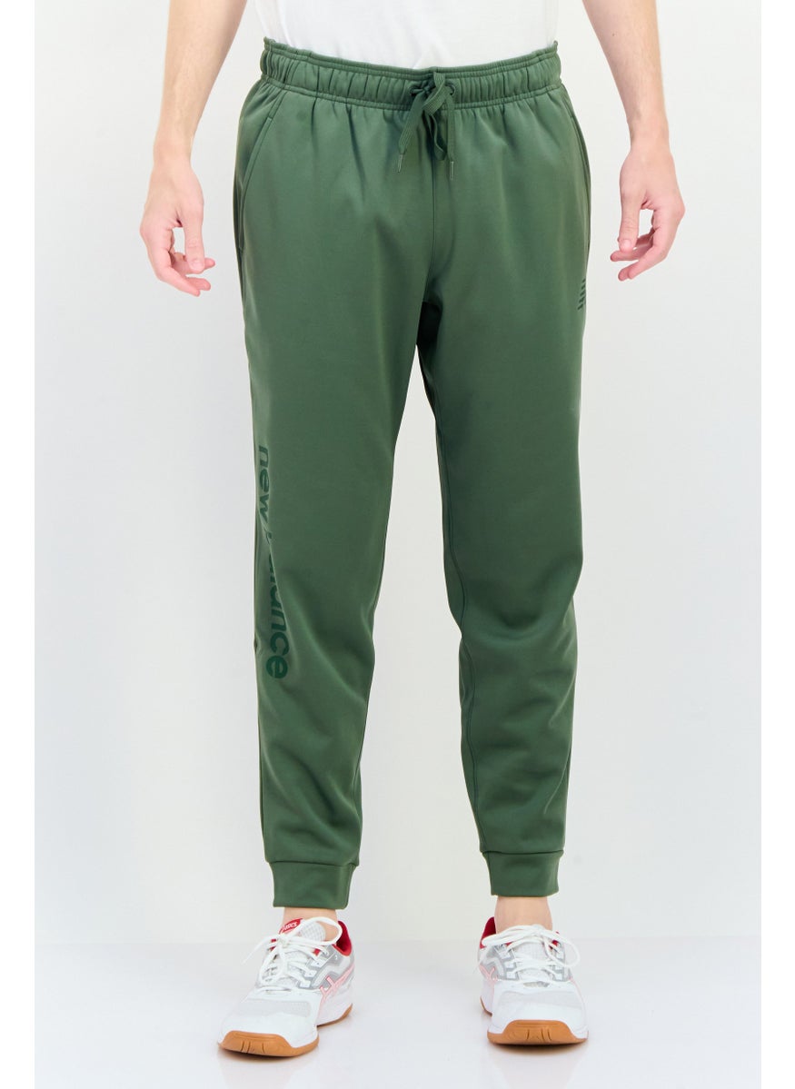 New Balance Men Athletic Fit Outdoor Sweatpants, Olive  - Image 1