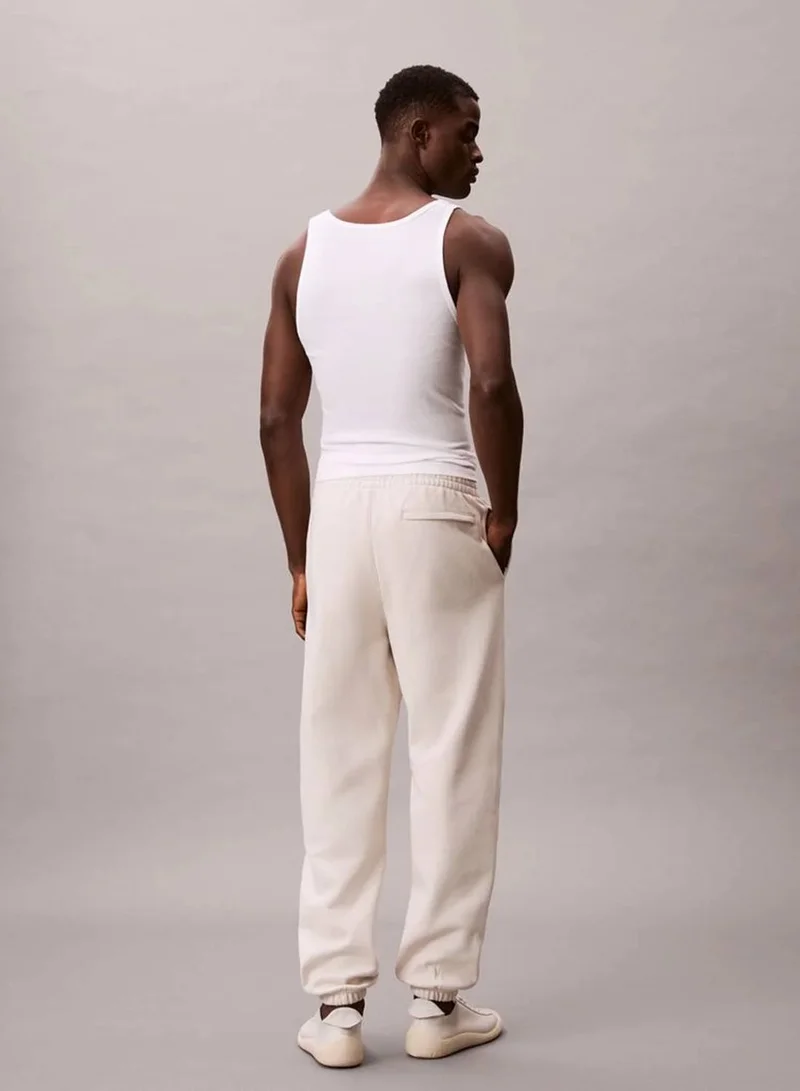 Calvin Klein Jeans Chalk Fleece Monogram Logo Patch Joggers for Men | Best Price UAE