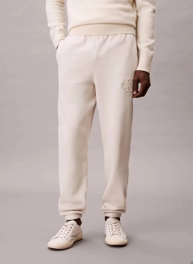 Calvin Klein Jeans Chalk Fleece Monogram Logo Patch Joggers for Men | Best Price UAE