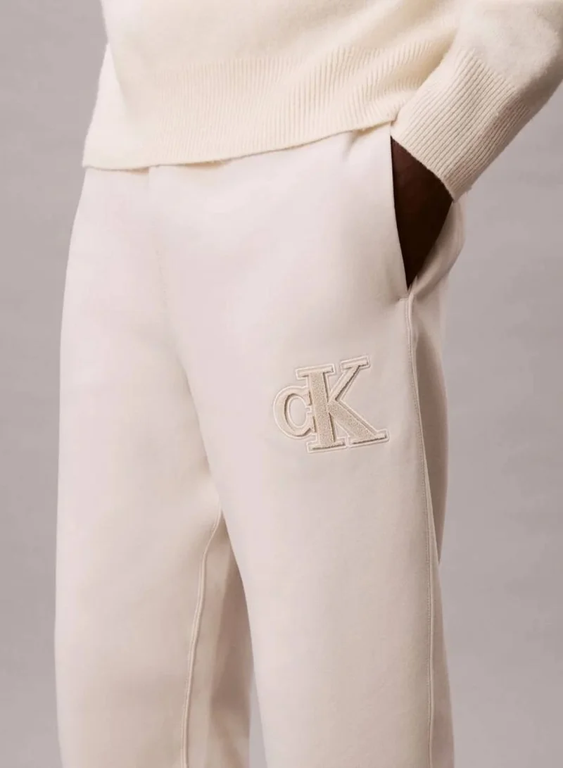 Calvin Klein Jeans Chalk Fleece Monogram Logo Patch Joggers for Men | Best Price UAE