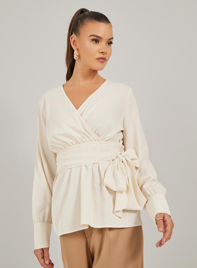 ستايلي بلوزة ملفوفة بأكمام بالون سادة مع تفاصيل ربط - Image 1