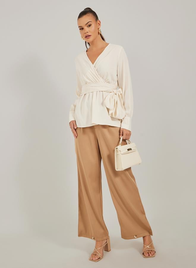 ستايلي بلوزة ملفوفة بأكمام بالون سادة مع تفاصيل ربط - Image 2