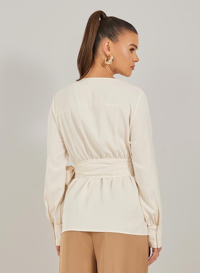 ستايلي بلوزة ملفوفة بأكمام بالون سادة مع تفاصيل ربط - Image 4