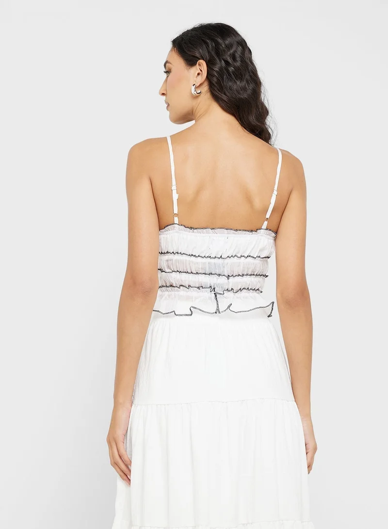 جينجر بلوزة كامي بكسرات وتفاصيل متباينة