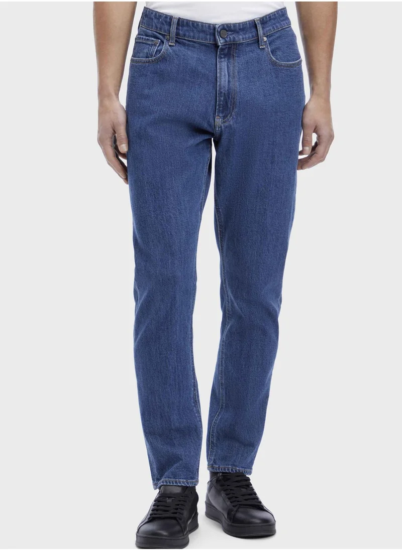 CALVIN KLEIN Mid Wash Tapered Fit Jeans