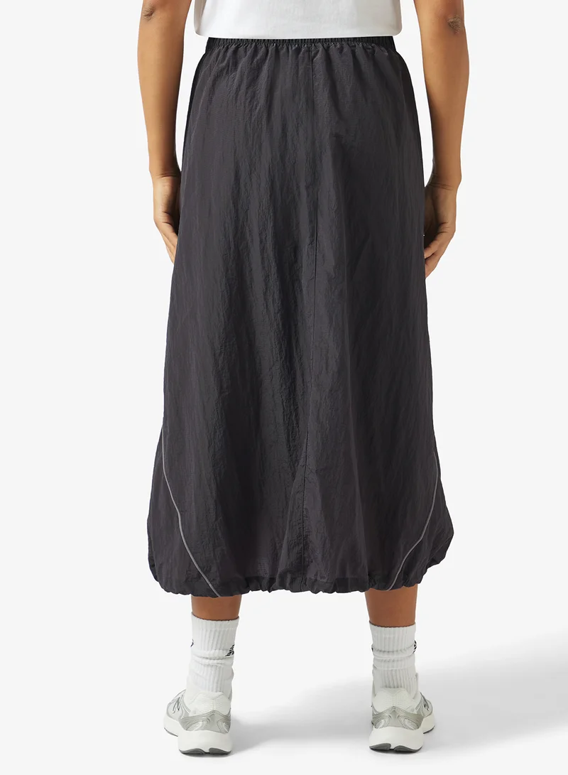 New Balance DARK NIGHT (DNT) Legacy Skirt for Women | Best Price UAE