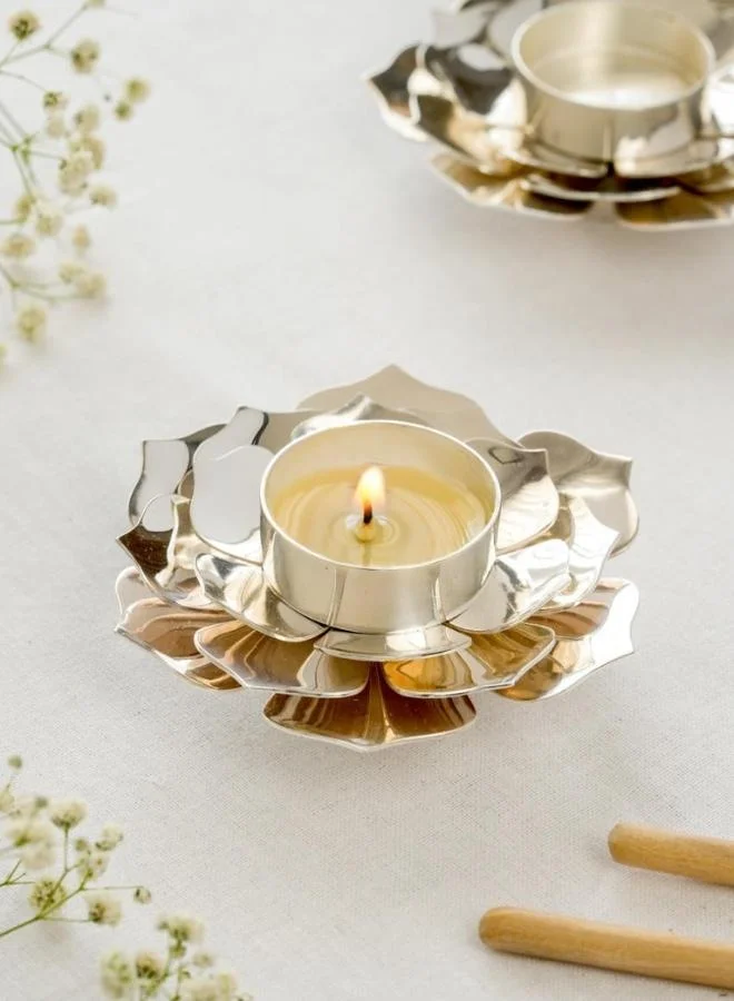Casa Quesera Bring serenity and elegance to your space with the Silver-Plated Lotus Tealight Holder by Quesera.