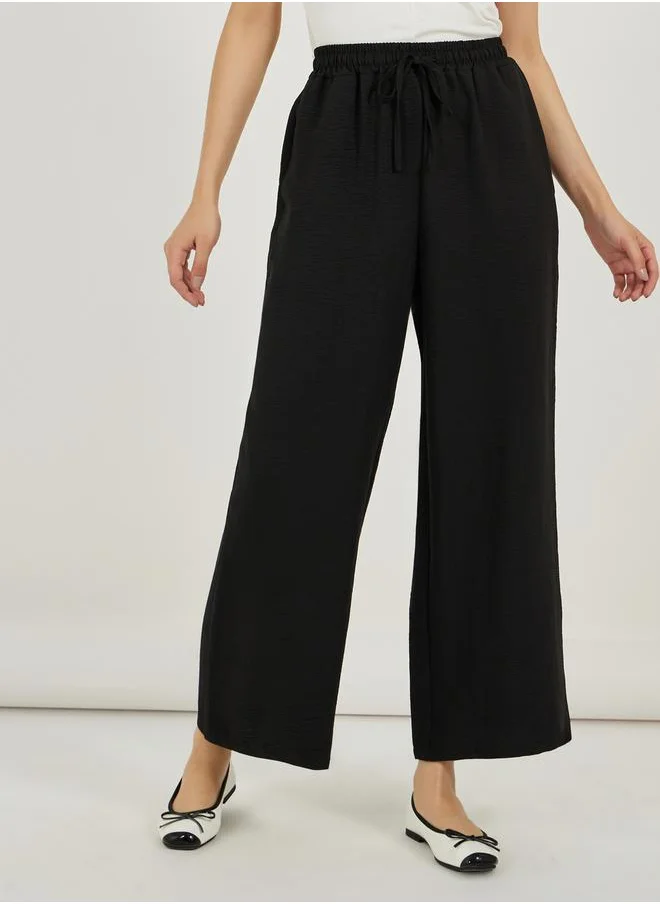 Styli Textured High Rise Wide Leg Pants with Drawcord