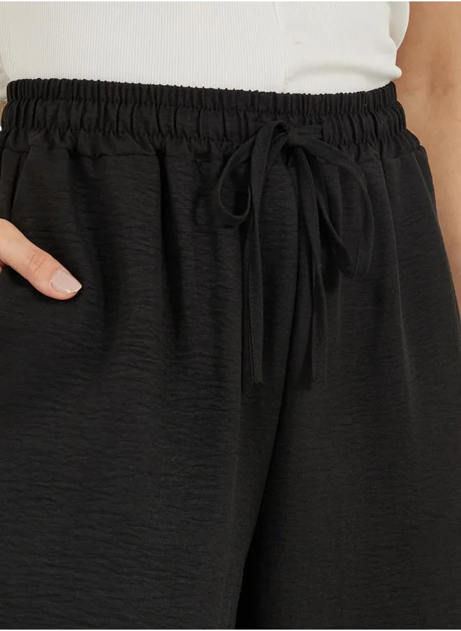 Styli Textured High Rise Wide Leg Pants with Drawcord