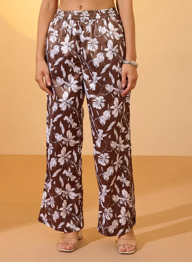 جلو باص بنطال ساتان بأرجل واسعة وطبعة زهور