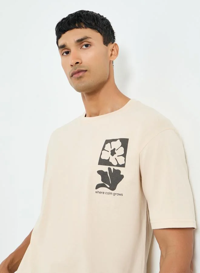 Styli Men Beige Graphic Print Oversized T-Shirt