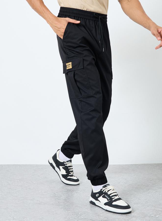 Styli Woven Oversized Cargo Joggers with Cuffed Hem and Badge - Image 1