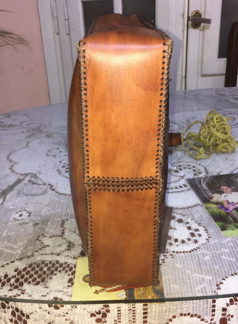 👜 Handmade Genuine Leather Shoulder Bag – Unique Pharaoh-Inspired Design 100% genuine leather – handcrafted with precision  Distinctive ancient Egyptian (Pharaonic) engravings  Large size for daily use or travel: 45×30 cm  2 main zippers for organized storage  Strong genuine leather shoulder straps  🛍️ Available now on Jumia & Noon From Holy of Holies Store – Where heritage meets style  - Image 5