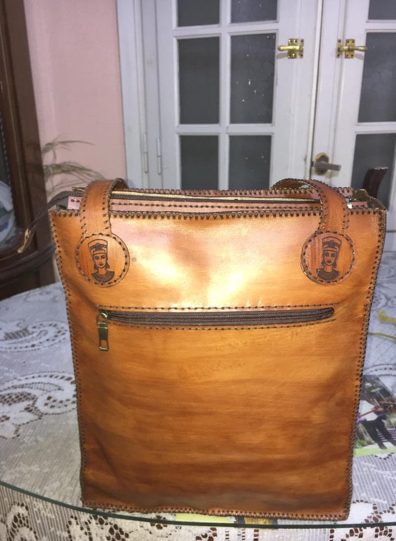 👜 Handmade Genuine Leather Shoulder Bag – Unique Pharaoh-Inspired Design 100% genuine leather – handcrafted with precision  Distinctive ancient Egyptian (Pharaonic) engravings  Large size for daily use or travel: 45×30 cm  2 main zippers for organized storage  Strong genuine leather shoulder straps  🛍️ Available now on Jumia & Noon From Holy of Holies Store – Where heritage meets style  - Image 2