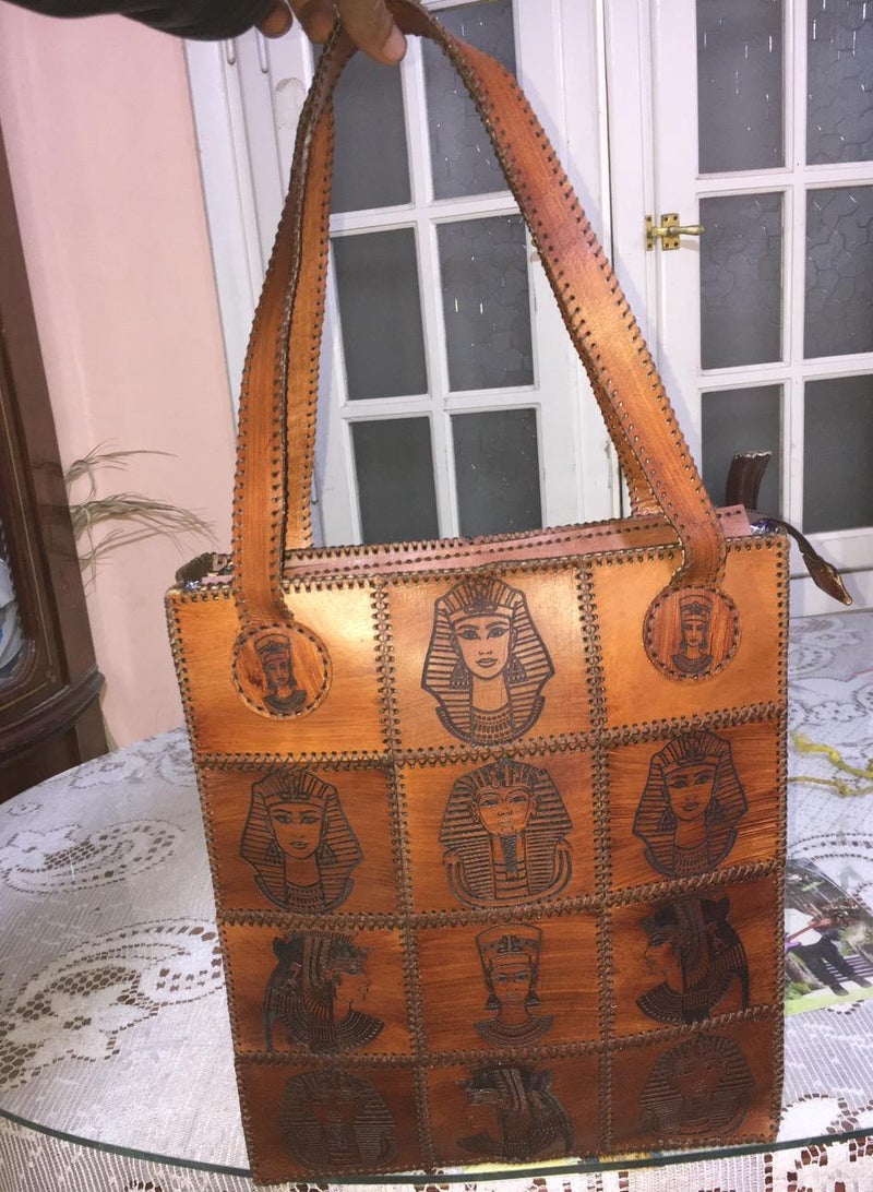 👜 Handmade Genuine Leather Shoulder Bag – Unique Pharaoh-Inspired Design 100% genuine leather – handcrafted with precision  Distinctive ancient Egyptian (Pharaonic) engravings  Large size for daily use or travel: 45×30 cm  2 main zippers for organized storage  Strong genuine leather shoulder straps  🛍️ Available now on Jumia & Noon From Holy of Holies Store – Where heritage meets style  - Image 4