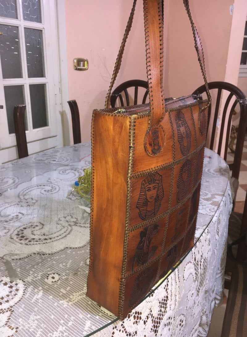 👜 Handmade Genuine Leather Shoulder Bag – Unique Pharaoh-Inspired Design 100% genuine leather – handcrafted with precision  Distinctive ancient Egyptian (Pharaonic) engravings  Large size for daily use or travel: 45×30 cm  2 main zippers for organized storage  Strong genuine leather shoulder straps  🛍️ Available now on Jumia & Noon From Holy of Holies Store – Where heritage meets style  - Image 3